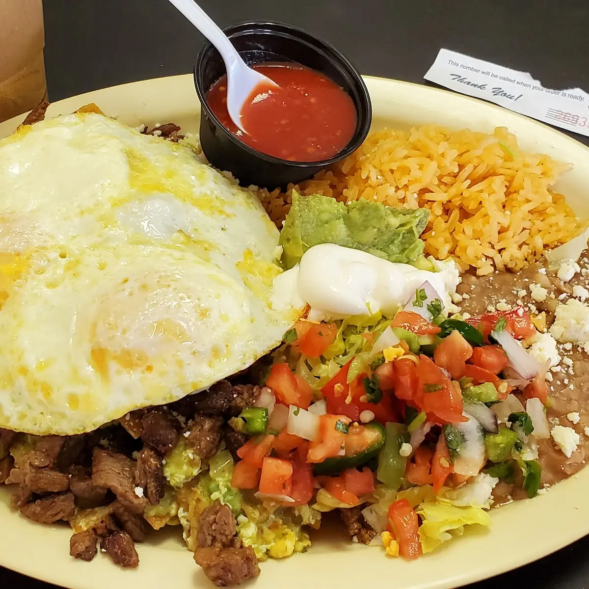 Chiliques with Carne Asada and Fried Egg