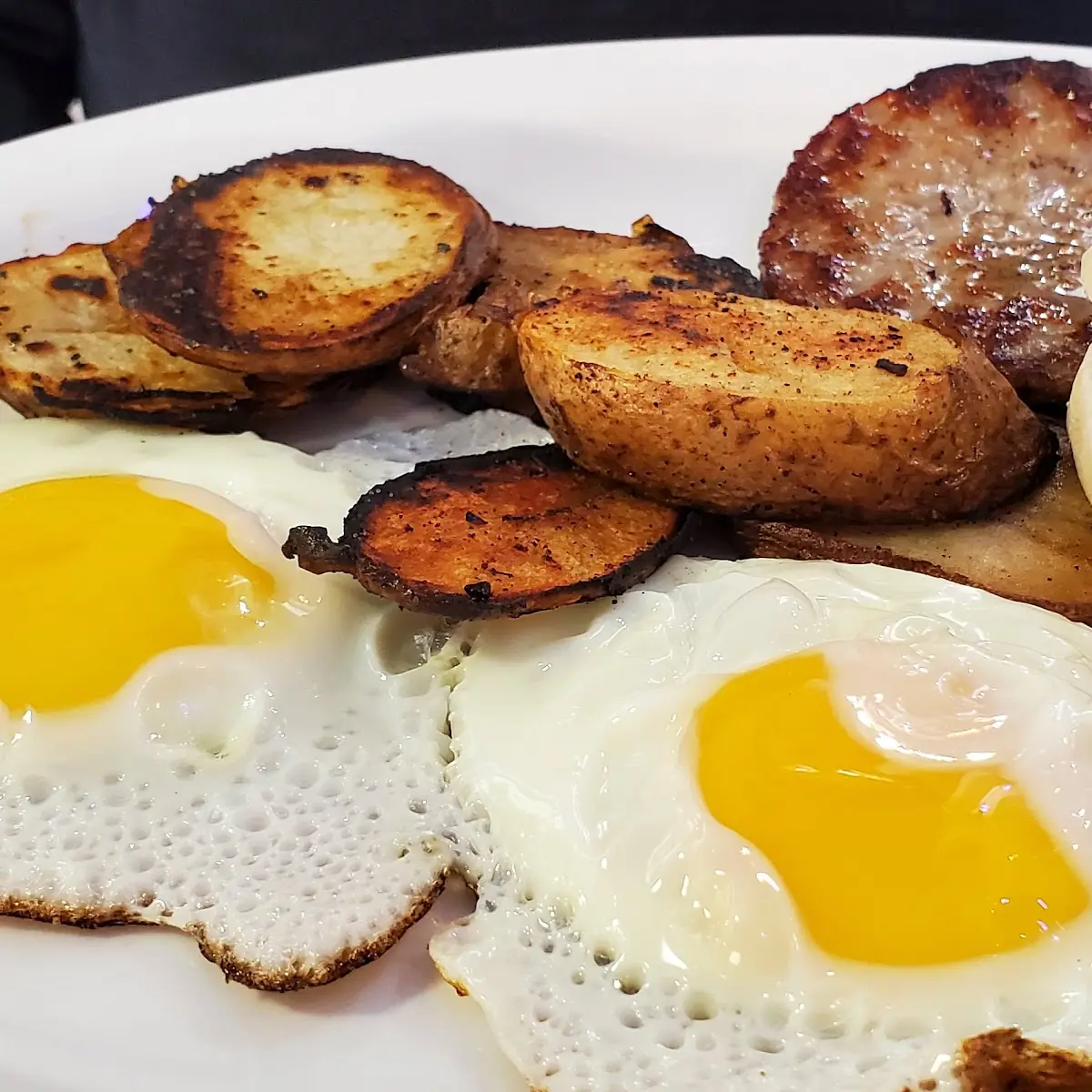 Eggs Fried Potatoes and English Muffin