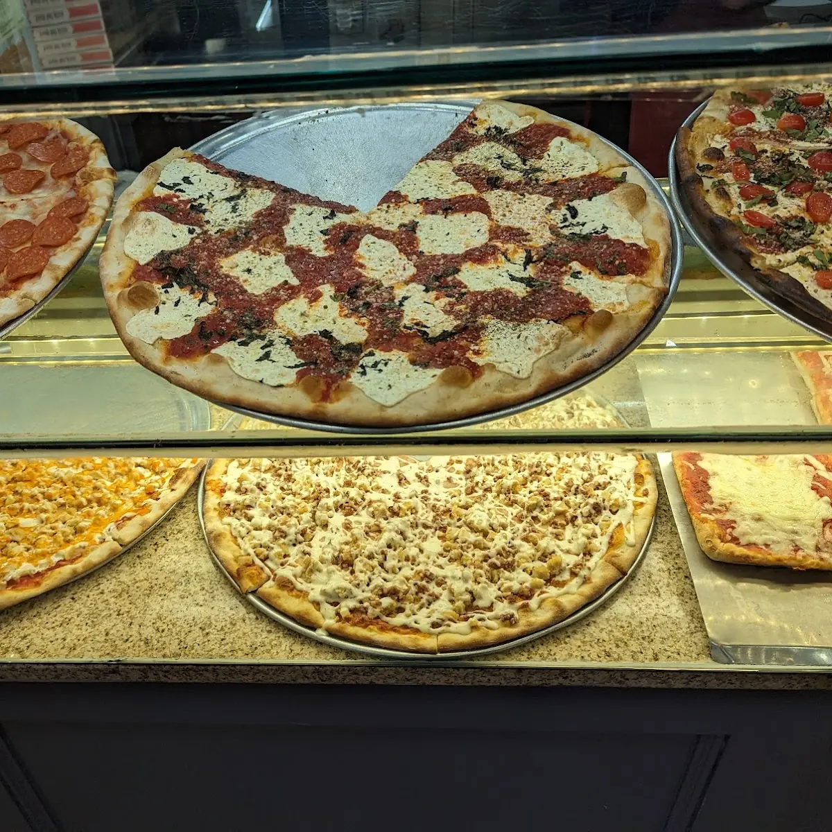 Assorted Pizza Slices on Display
