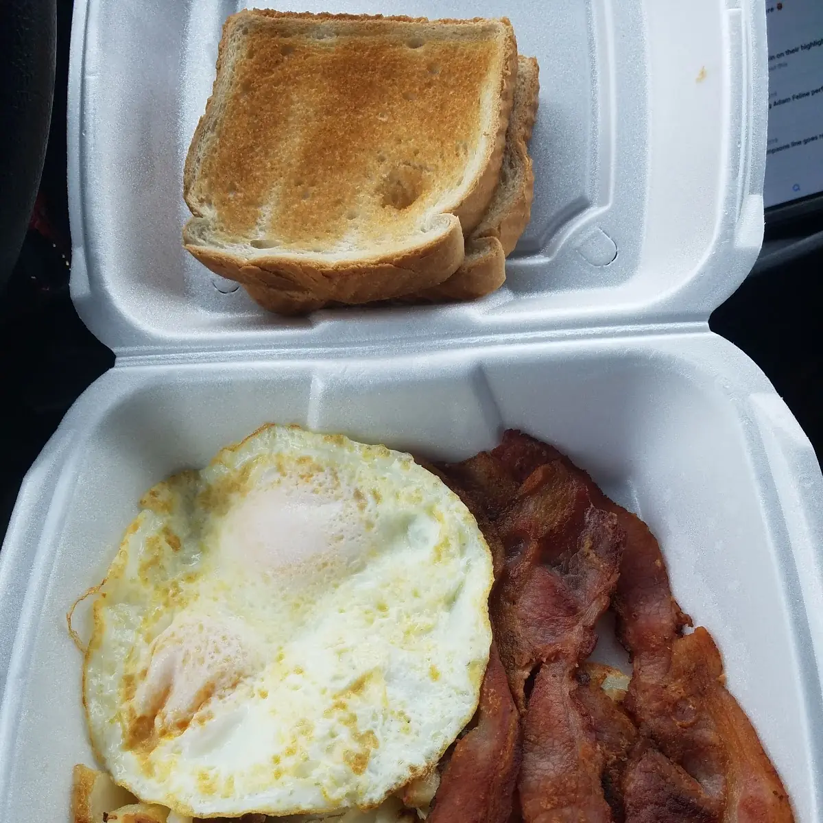 Eggs over Medium with Hash Browns Bacon and White Toast