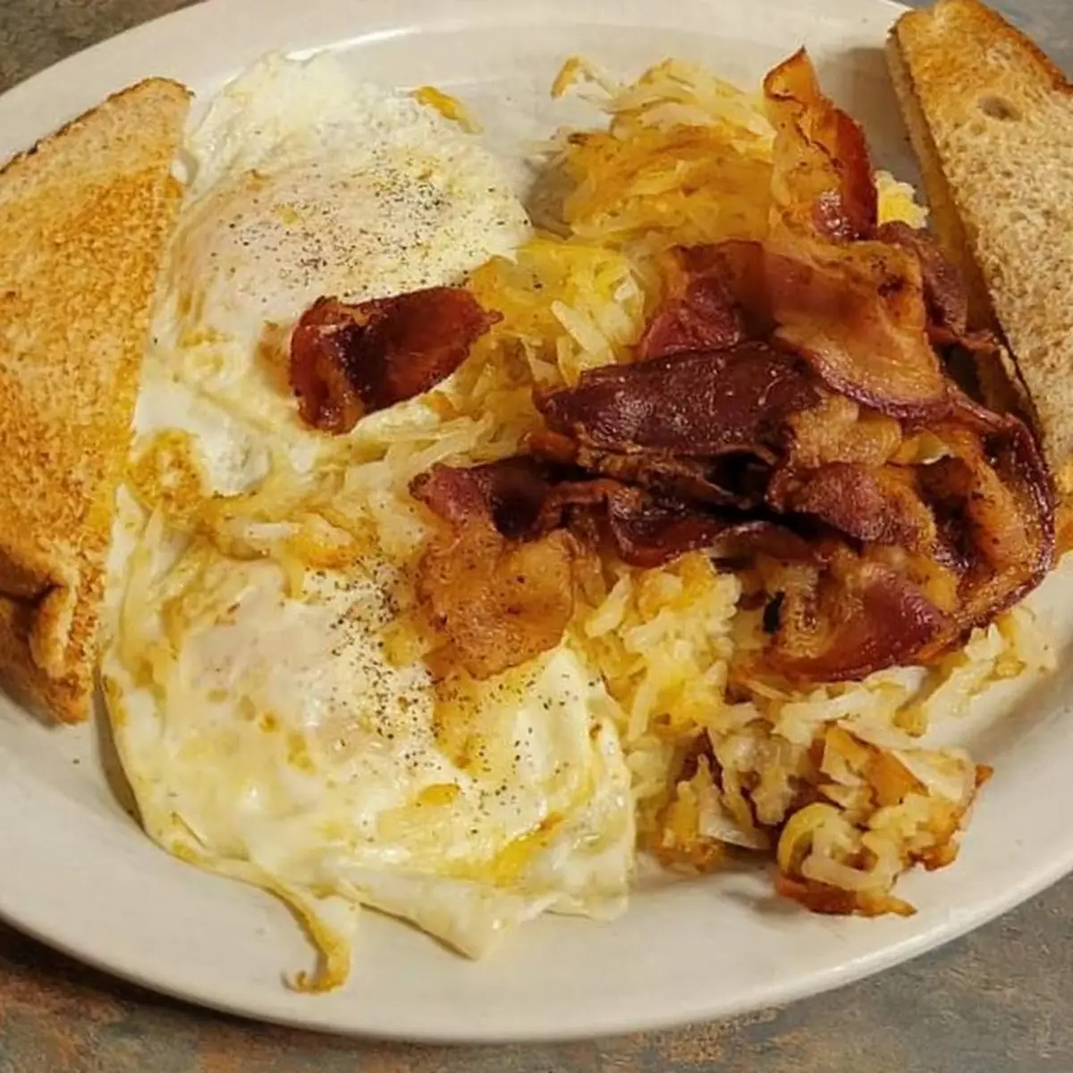Two Eggs Bacon Potatoes and Toast