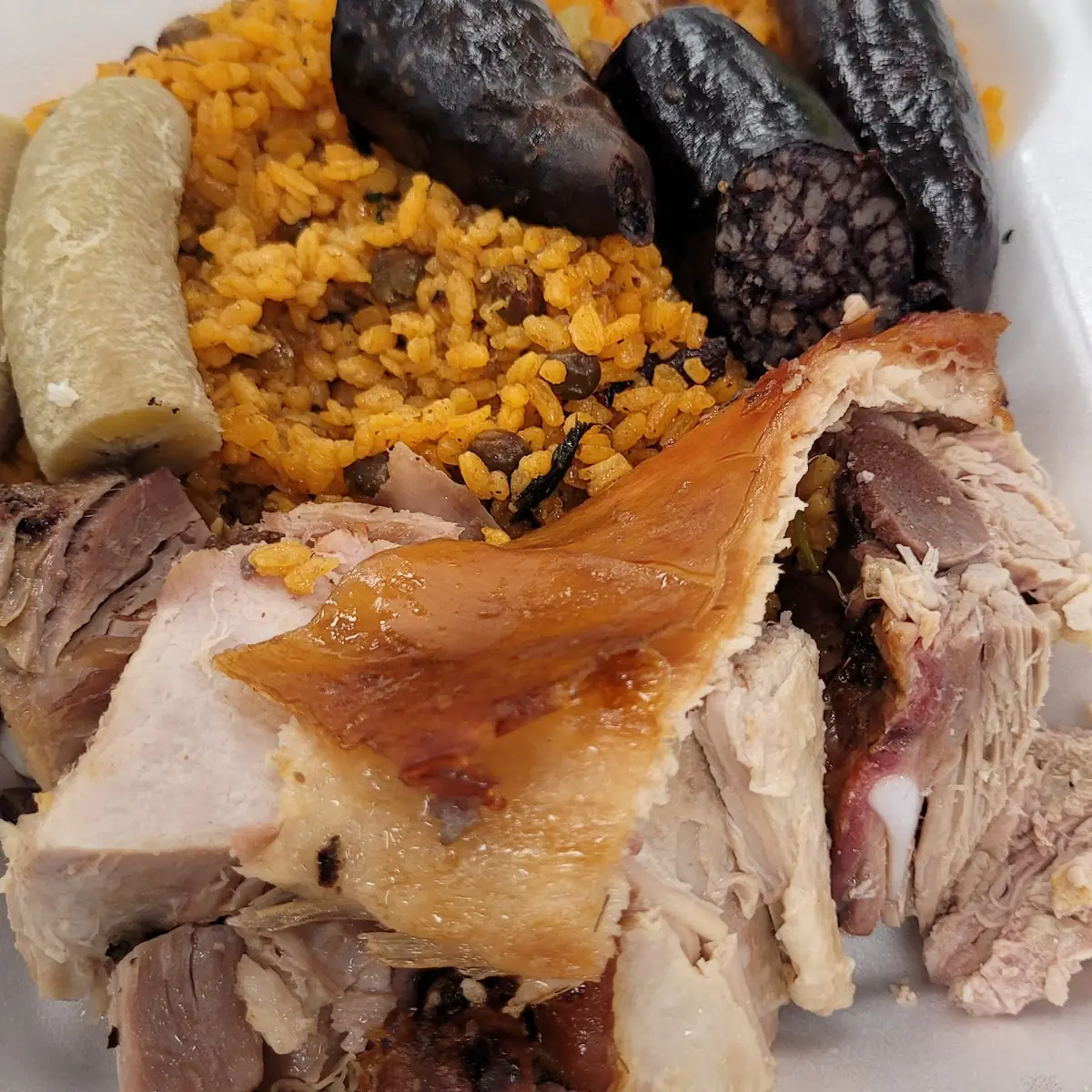 Arroz Con Gandules Lechón Y Morcillas