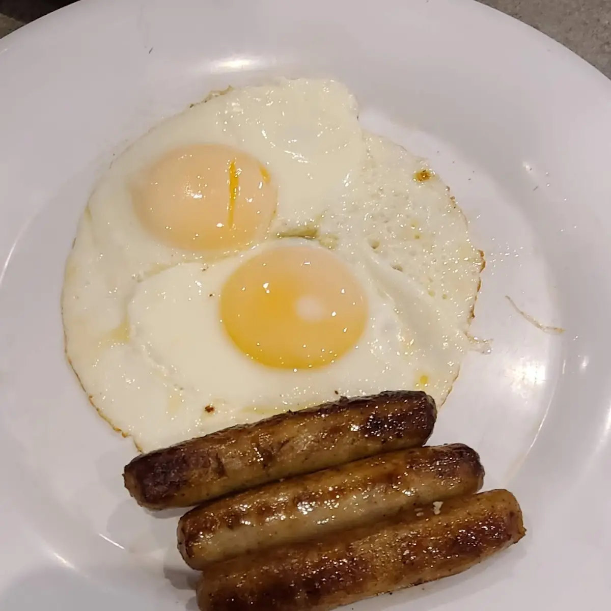 Two Country Style Biscuits with Two Eggs and Bacon