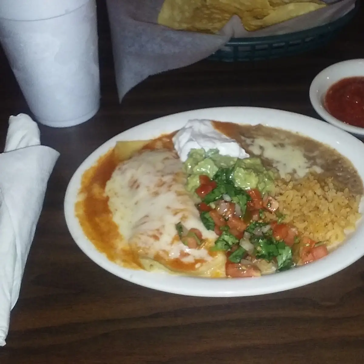 One Guacamole Tostada One Beef Enchilada Rice & Refried Beans