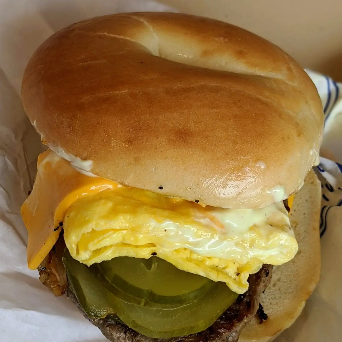 Steak Egg and Cheese Bagel with Pickles