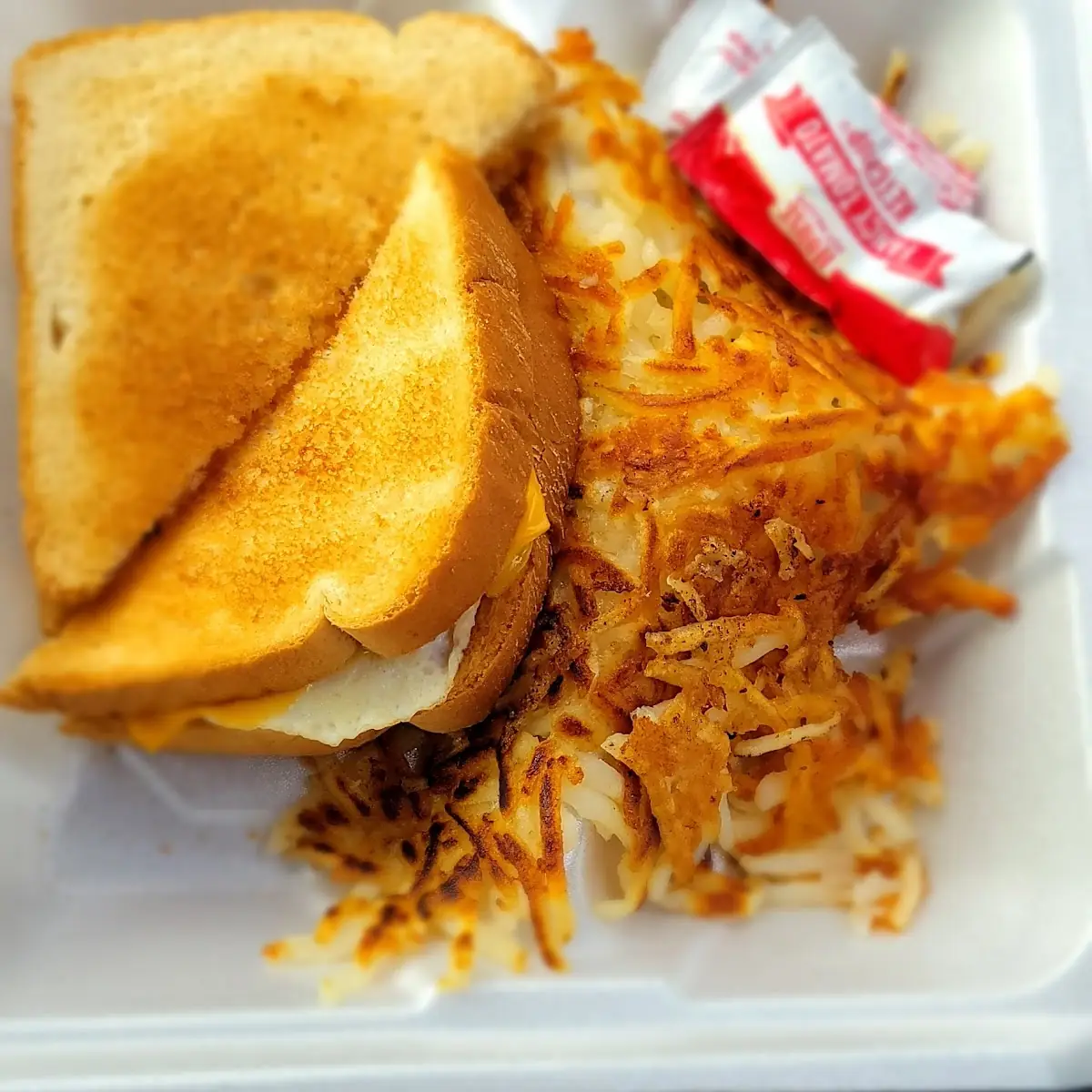 Egg Sandwich with Cheese and Hash Browns