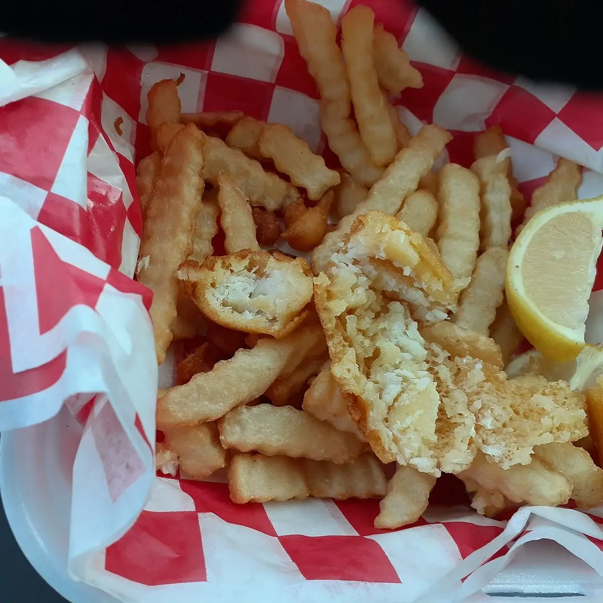 Fish and Chips 2 Small Pieces One Is Broke in Half the Other Is Opened Up