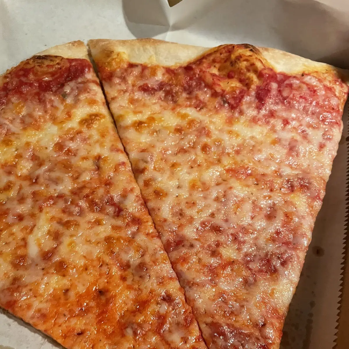 Famous Thin Crust Pizza Slice
