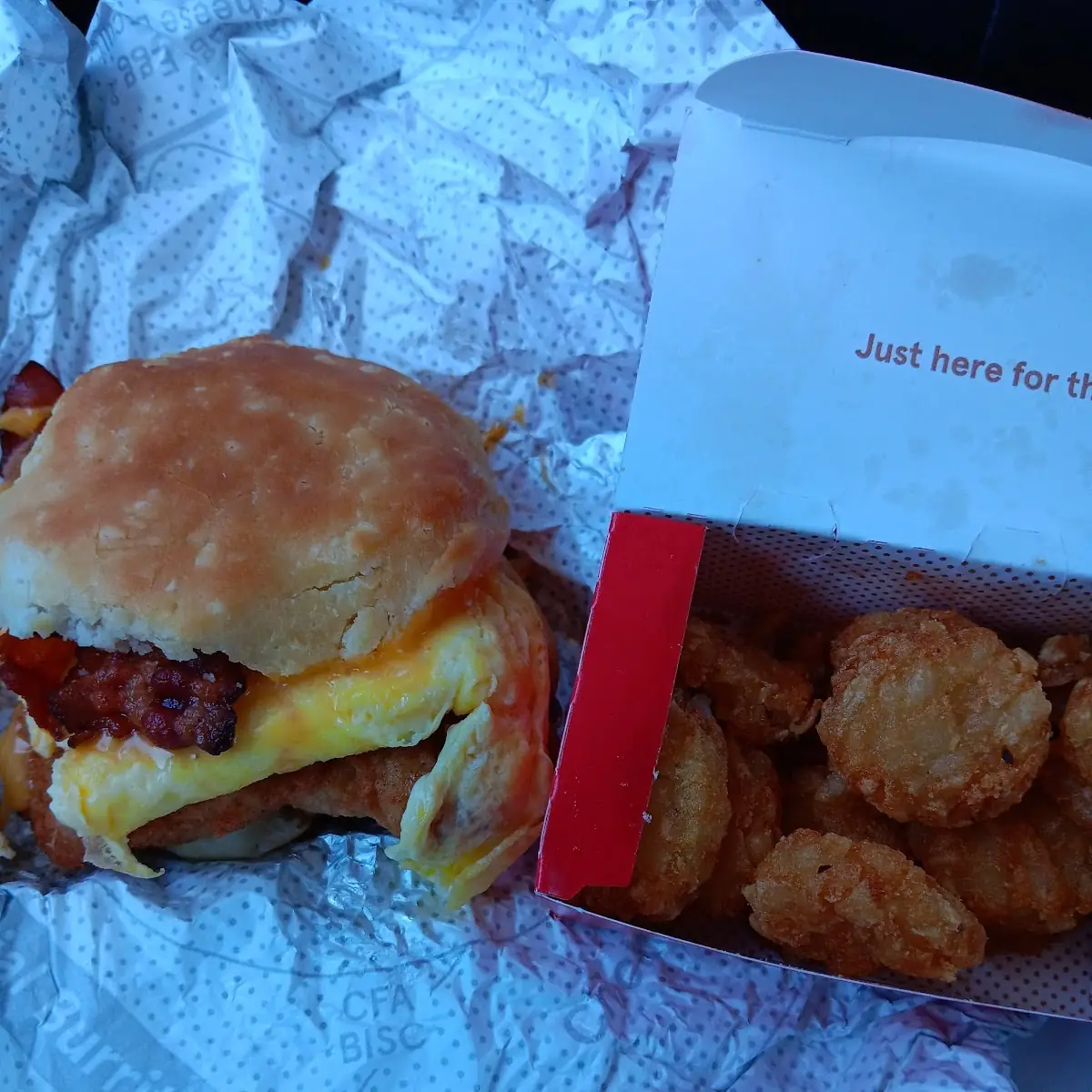 Chic Fil a Biscuit with Egg Cheese and Bacon Added