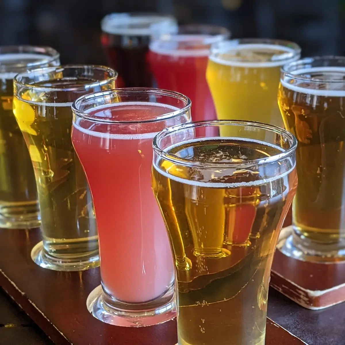 Varied Beer Flight on Wooden Paddle