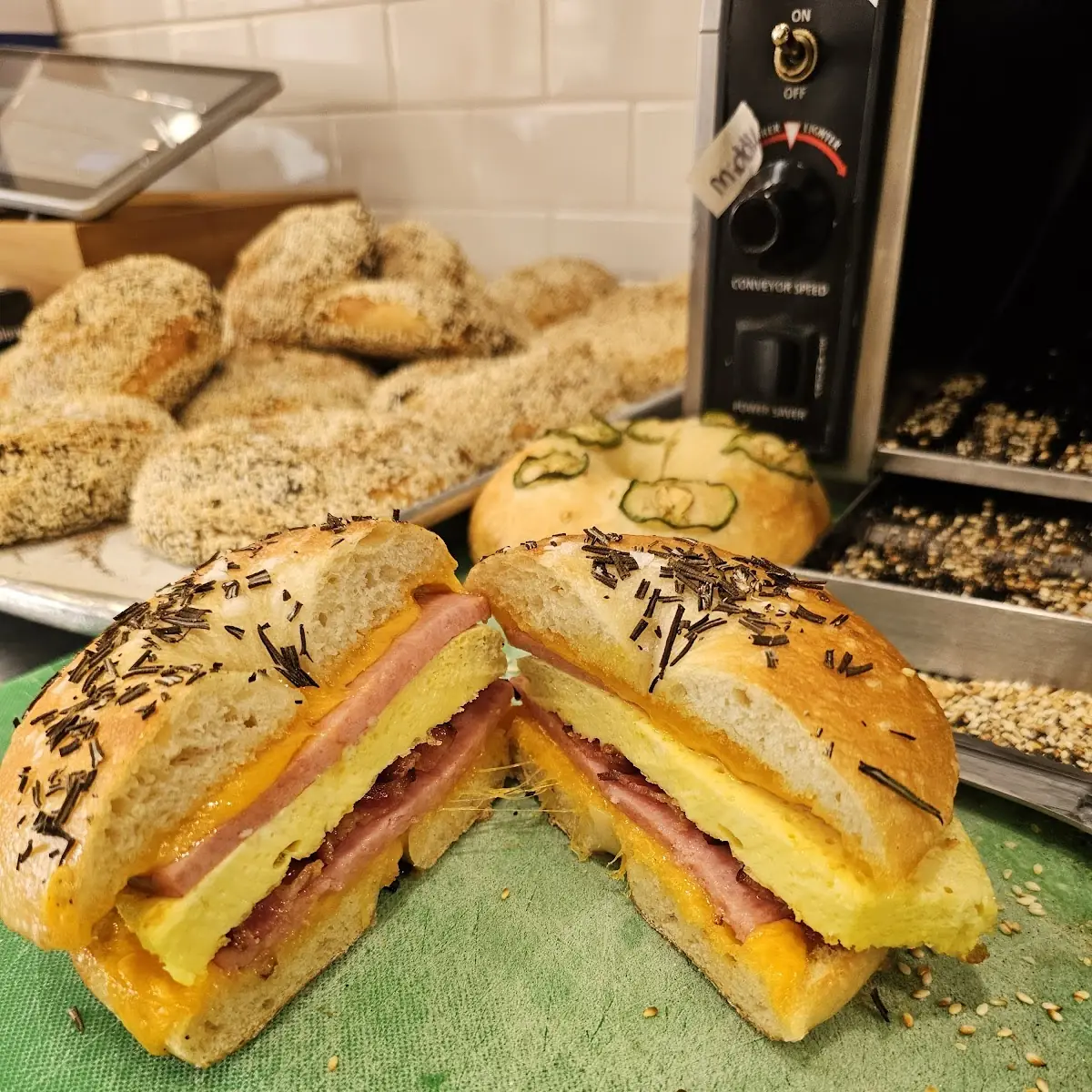 Pork Roll Egg Cheddar Cheese and Bacon on Everything Bagel