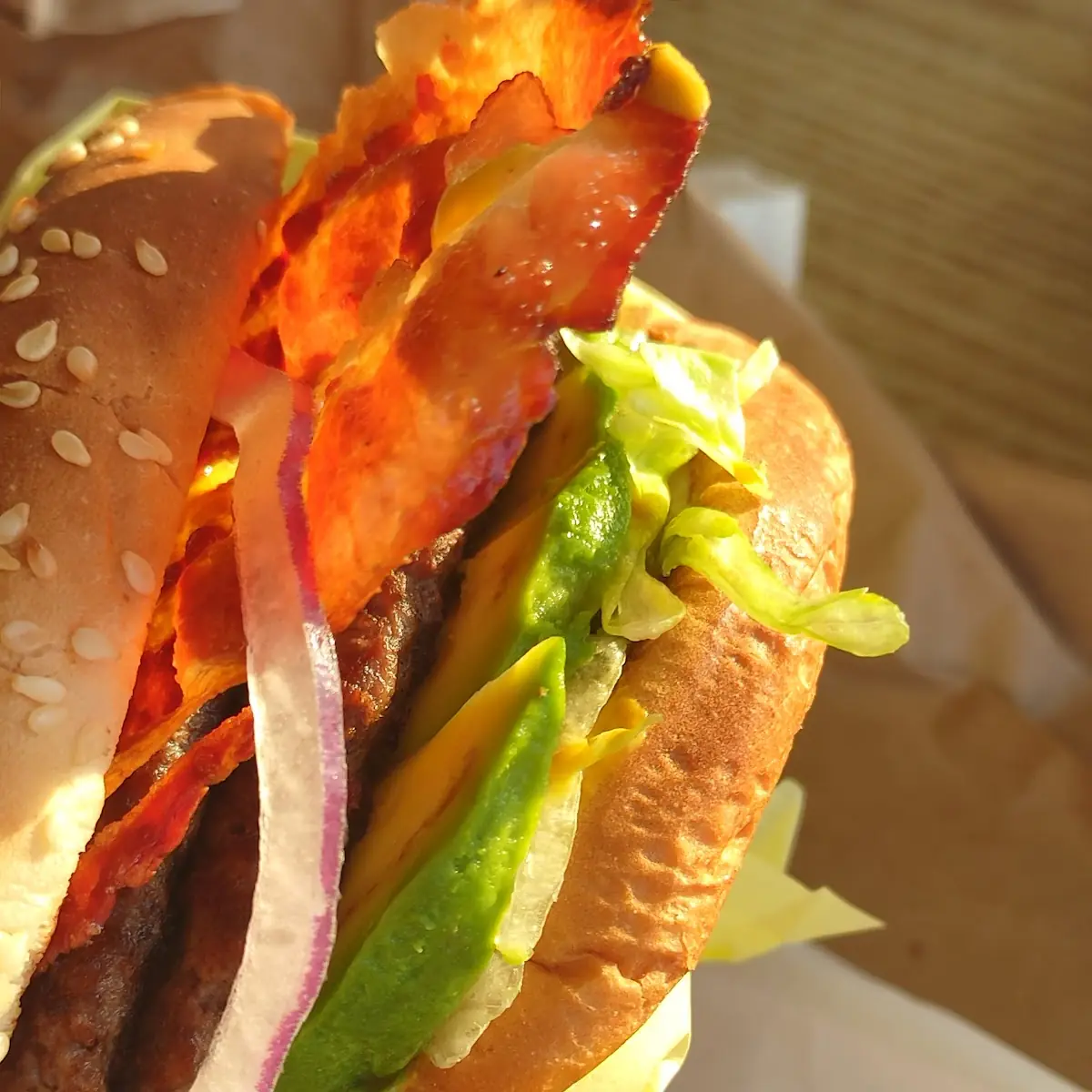 A Bacon Avocado Lettuce Tomatoes Pickles Onions Light Mayonnaise and Mustard