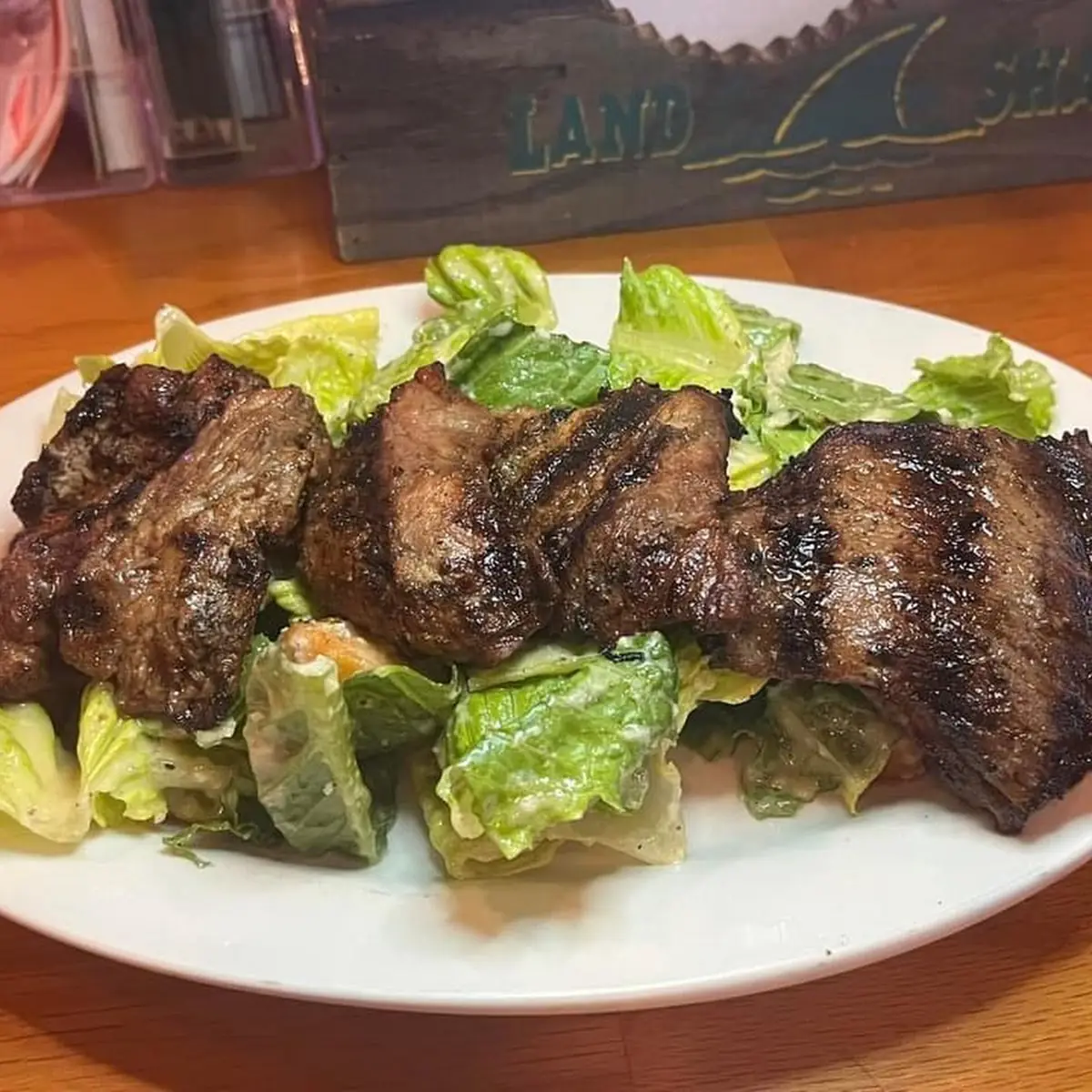 Steak Tips over Caesar Salad