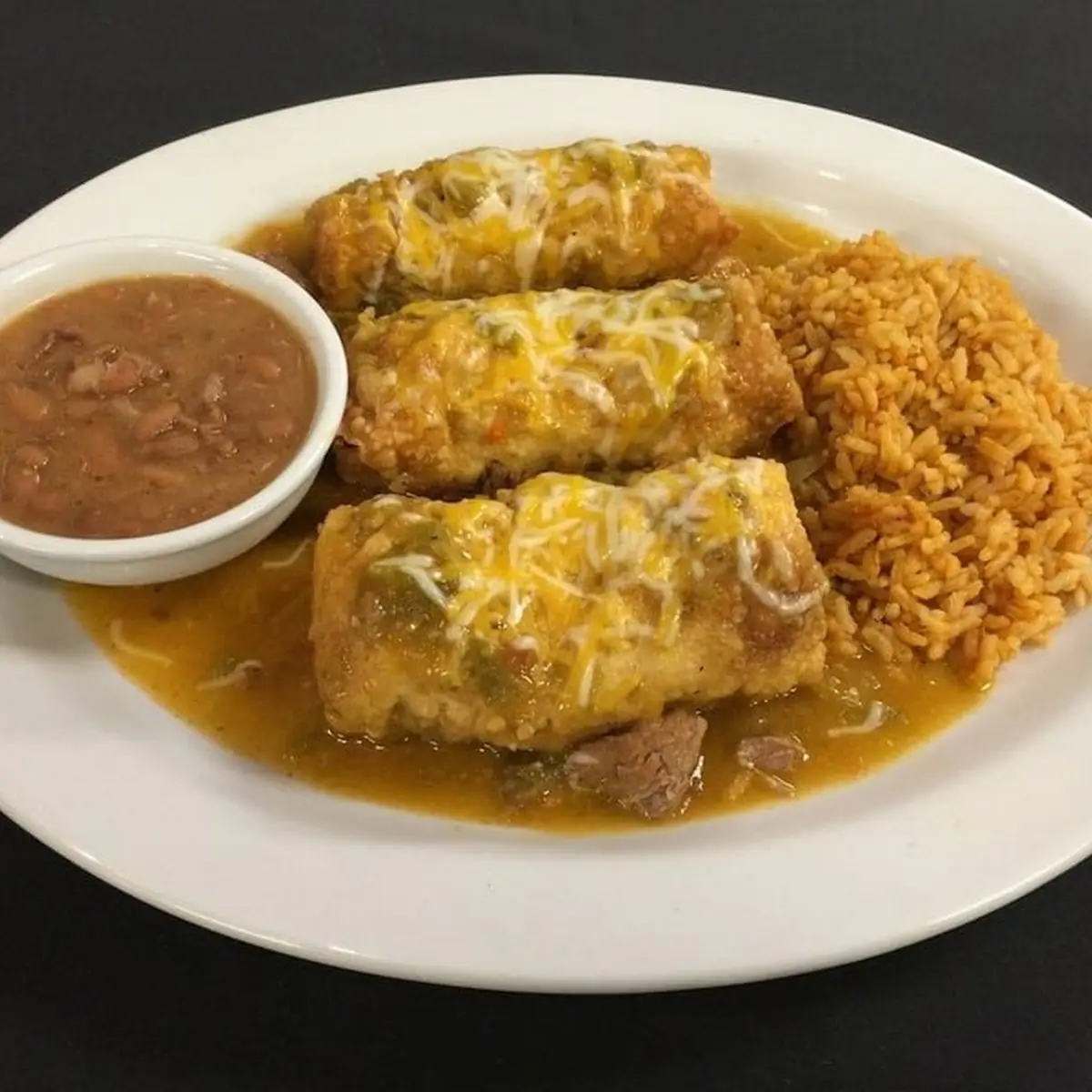 Cheese and Onion Enchiladas with Cheese Sauce