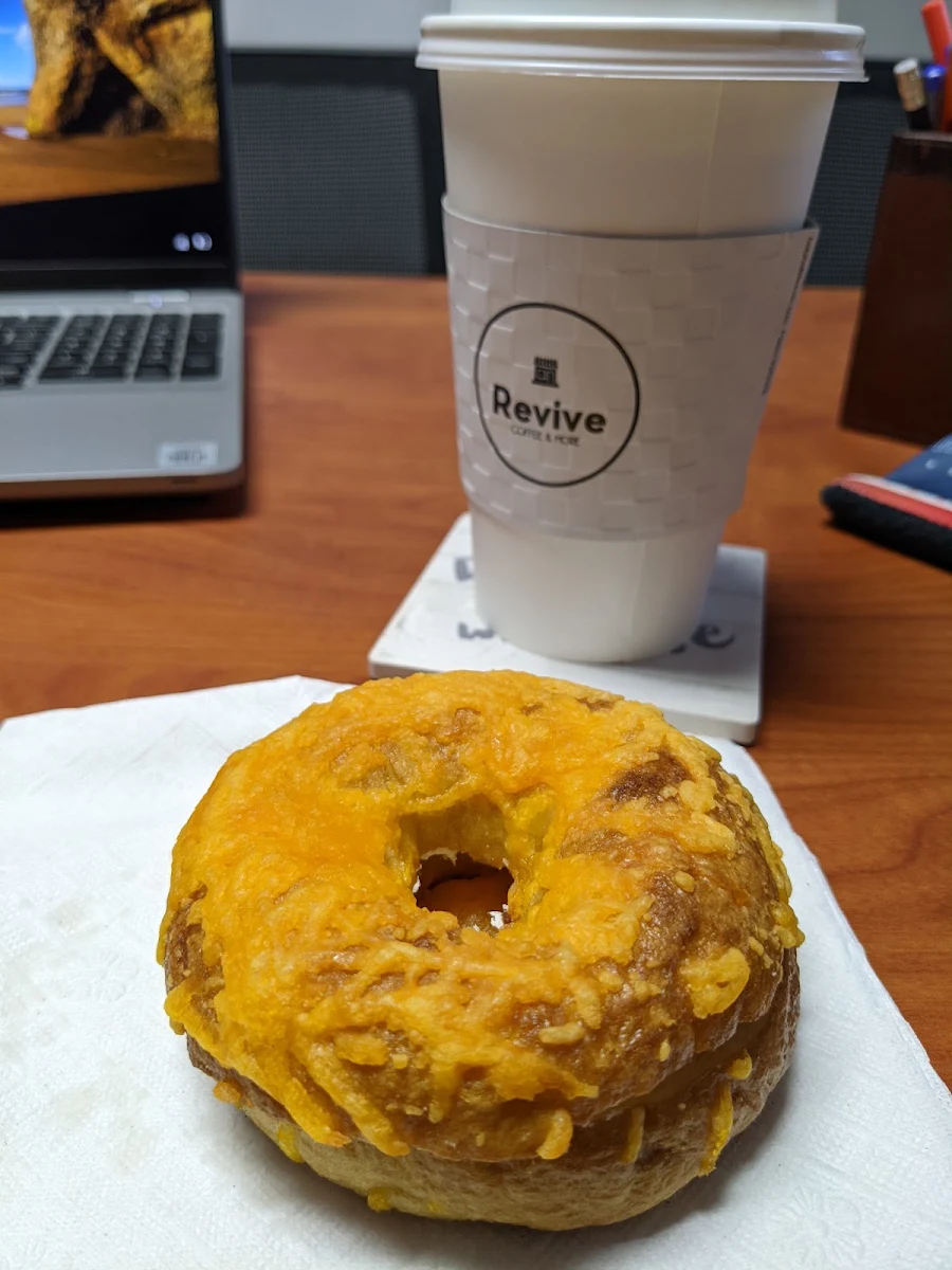 Cheese Bagel with Cream Cheese and a Latte