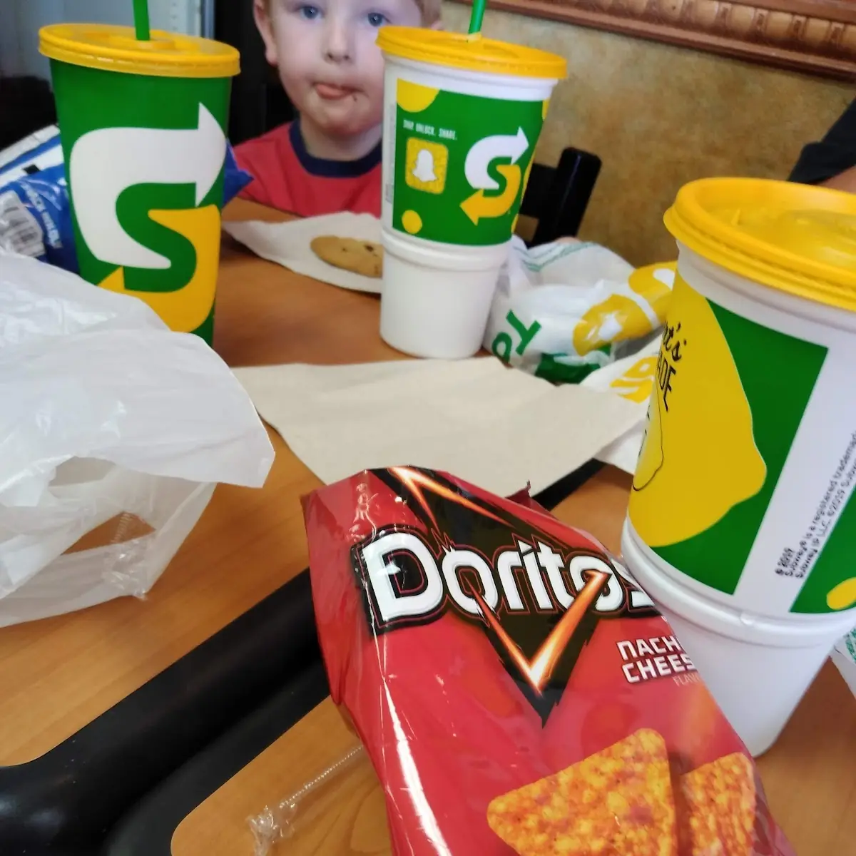 A Sub Sandwich Doritos and a Drink