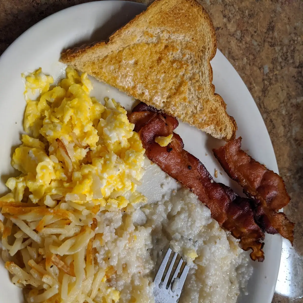 Hash Browns Eggs Bacon and Grits