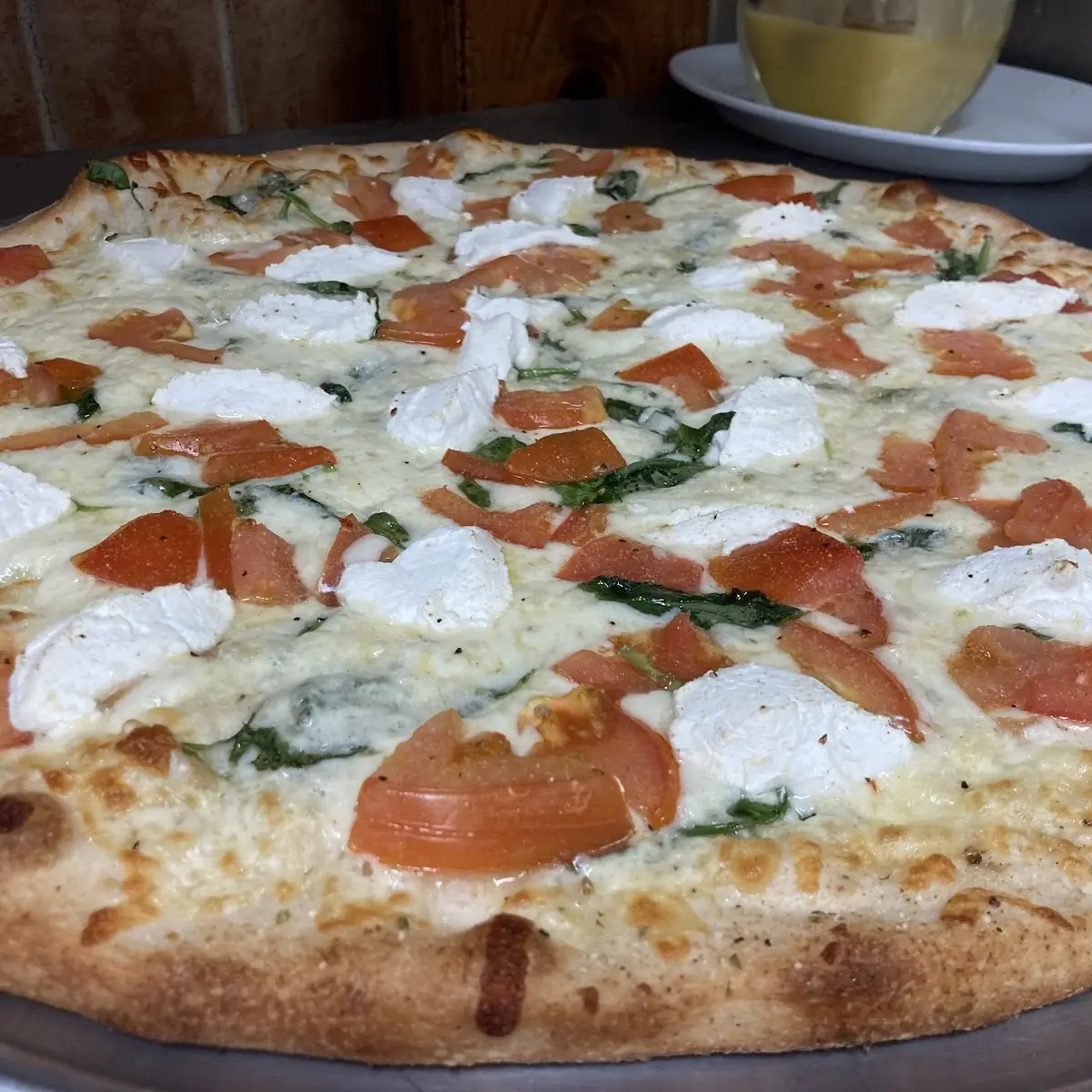 White Garlic Spinach Tomato and Ricotta Pie