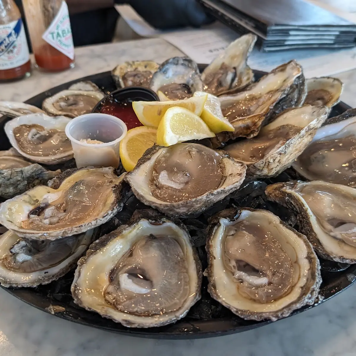 Raw Oysters with Lemon Wedges