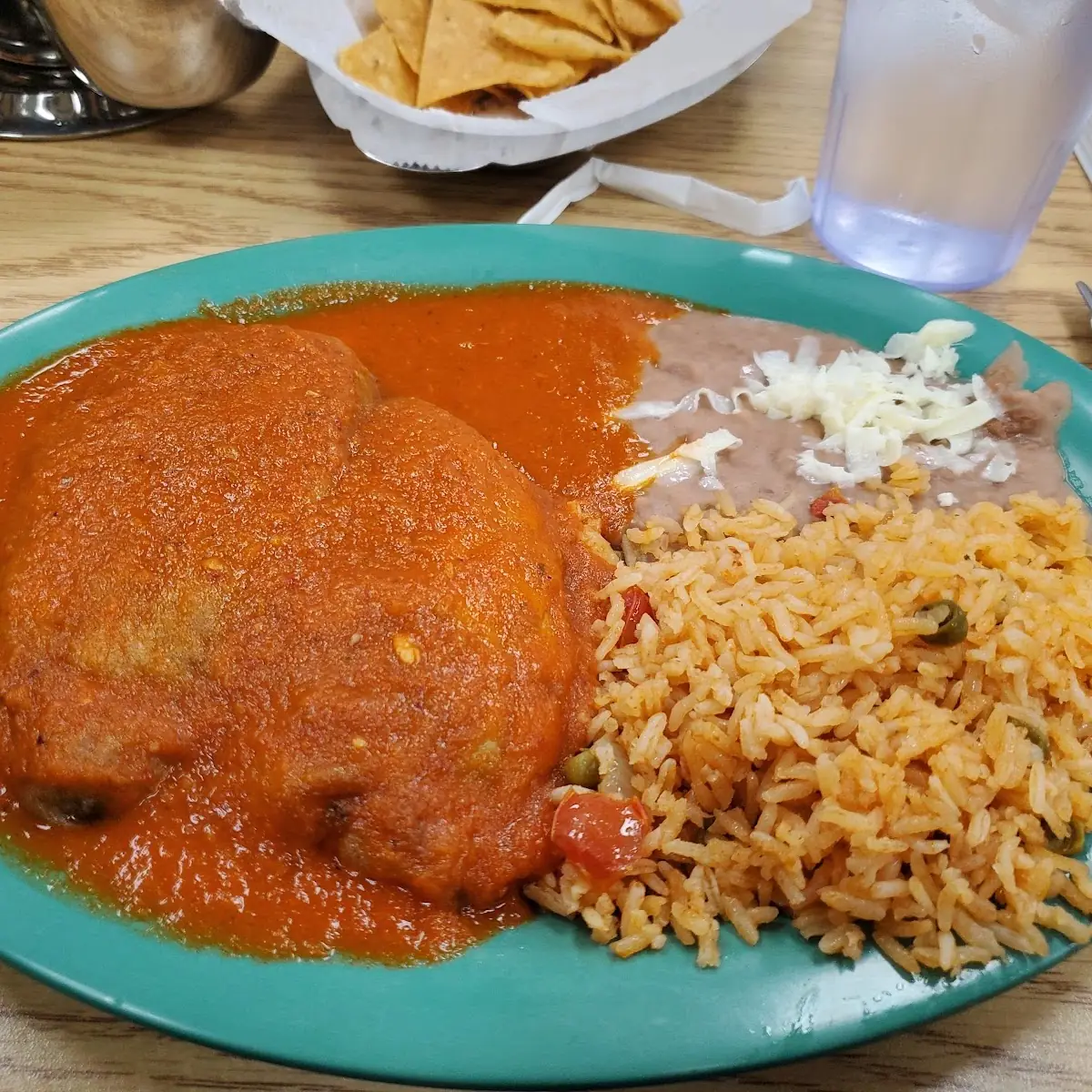 Chiles Rellenos En Salsa Roja Mexican Poblado Pepper Stuffed with Cheese on Red Sauce