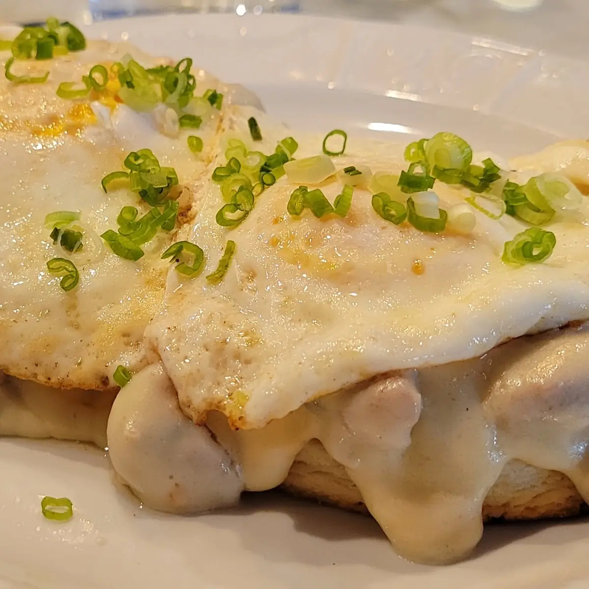 Biscuits and Sausage Gravy Add Two over Easy Eggs