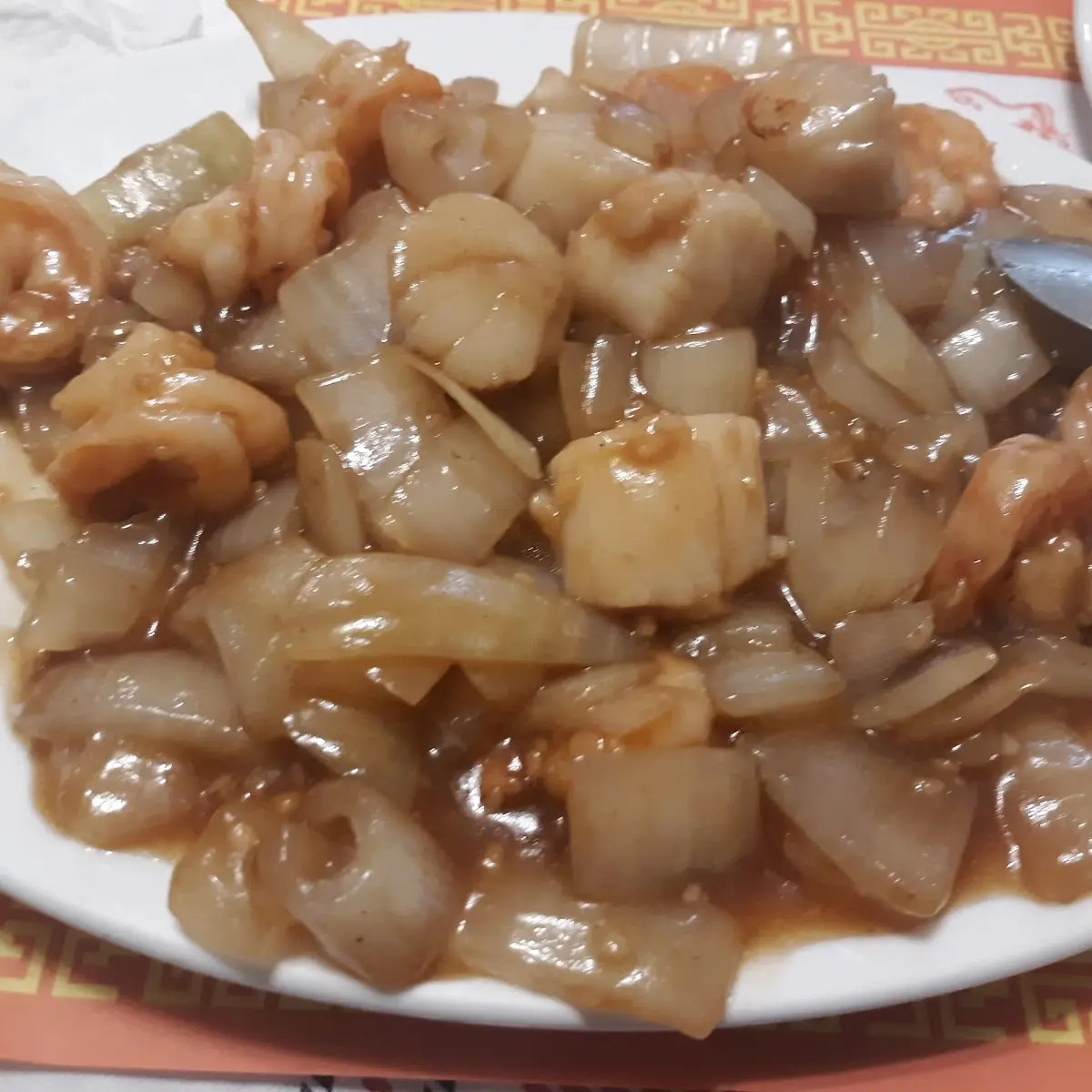 Scallops and Shrimp in a Garlic Sauce with Onions