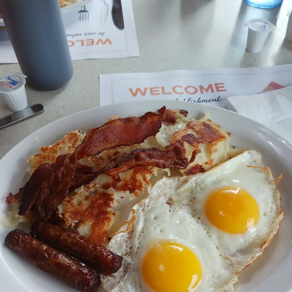 Eggs Bacon Sausage and Homefries
