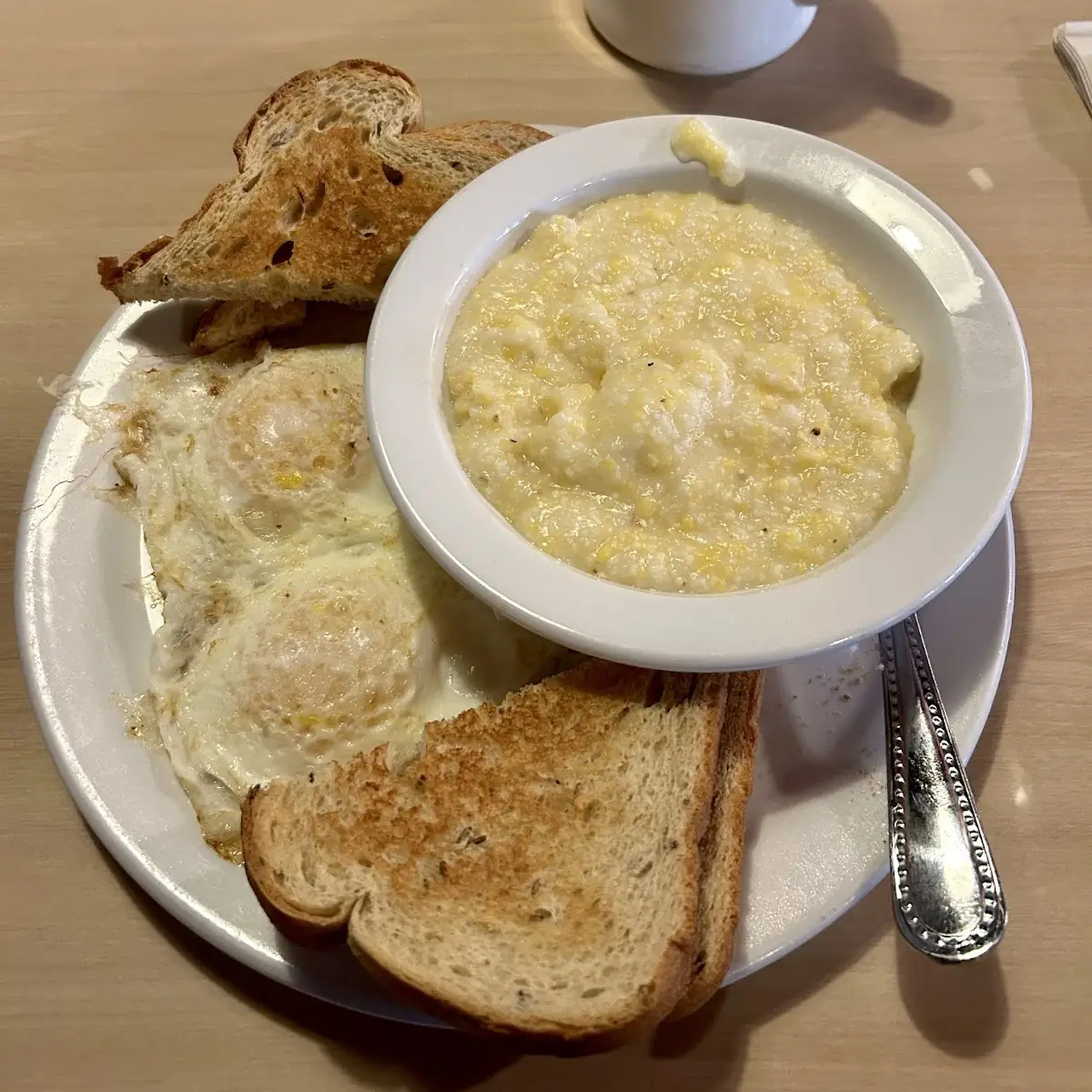 Two Eggs over Medium with Grits and Toast