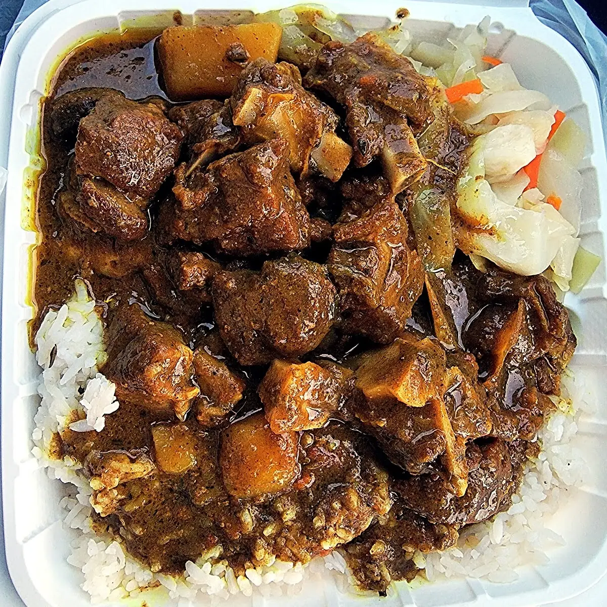 Curried Goat with Rice & Peas and Steamed Cabbage