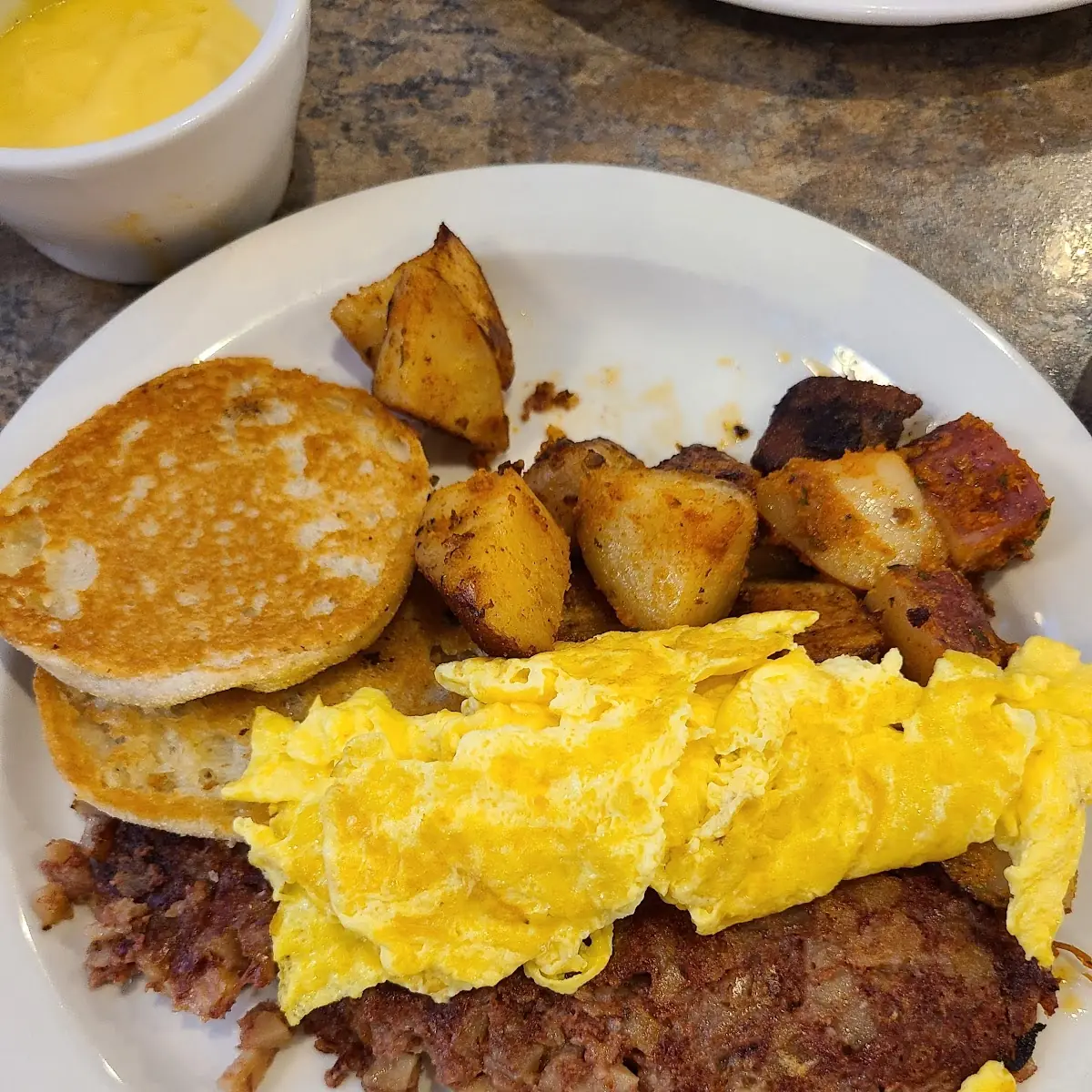 Corned Beef Hash Scrambled Eggs and a Grilled English Muffin