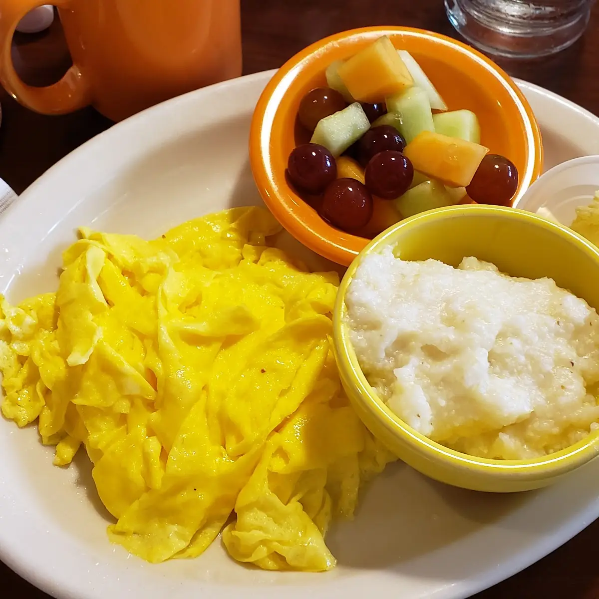 VIB with Scrambled Eggs Grits and Fruit Salad