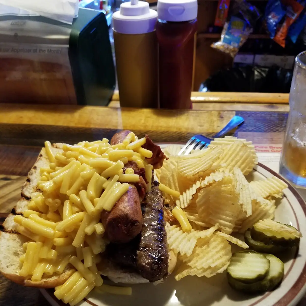 A Bacon Wrapped Hot Dog with Mac N Cheese