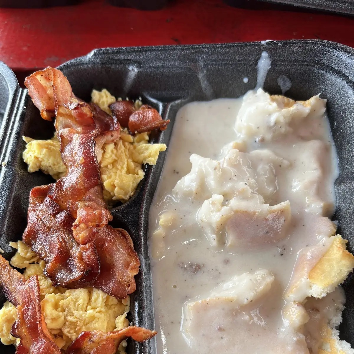 Biscuit and Gravy with Two Eggs and Bacon