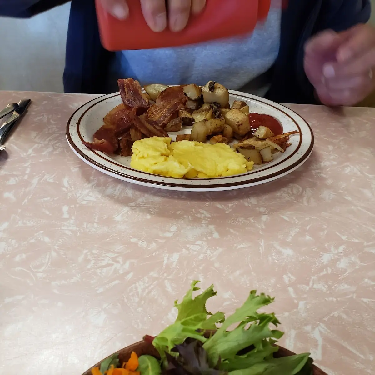 Bacon and Scrambled Eggs with Country Potatoes and Wheat Toast