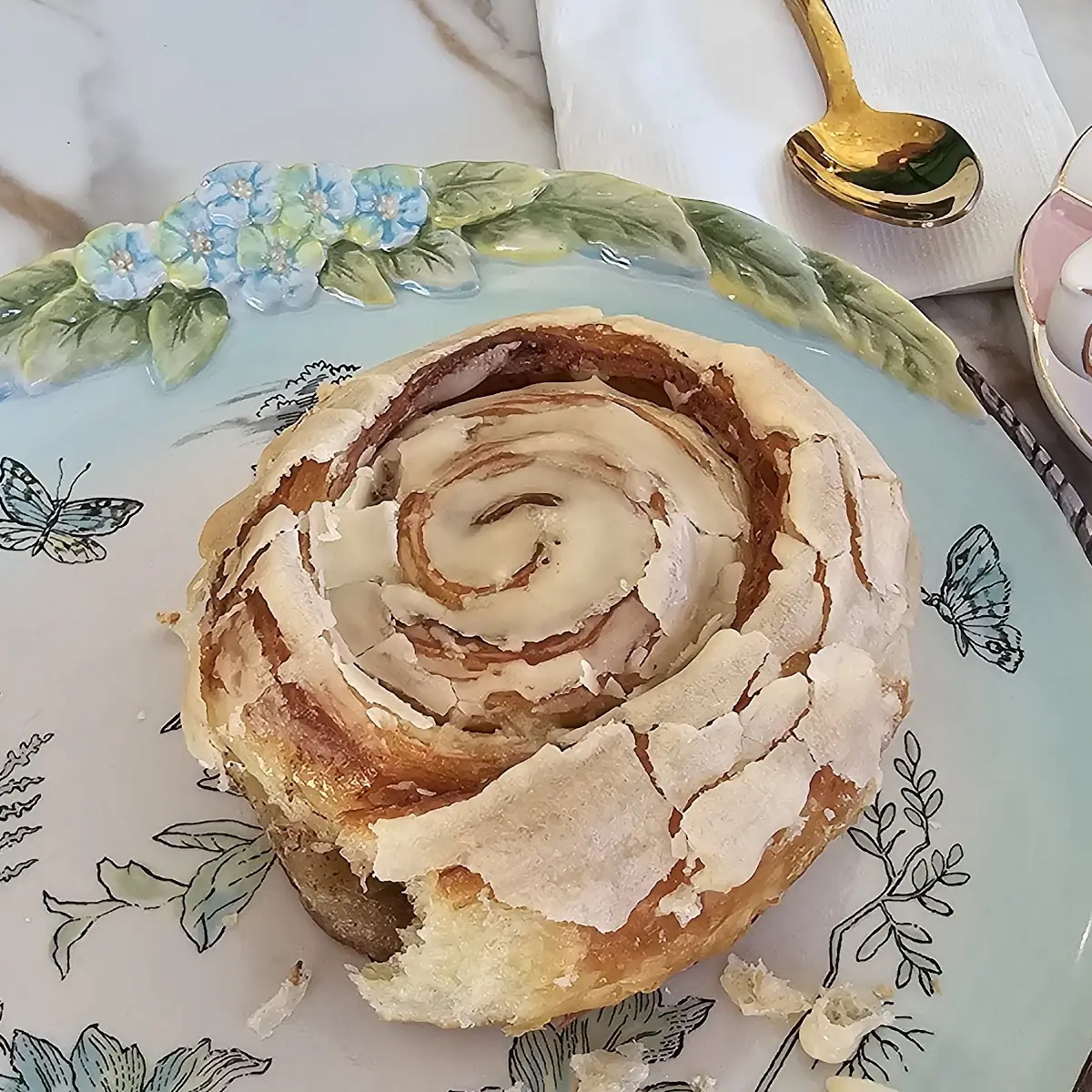 Frosted Cinnamon Roll on Plate