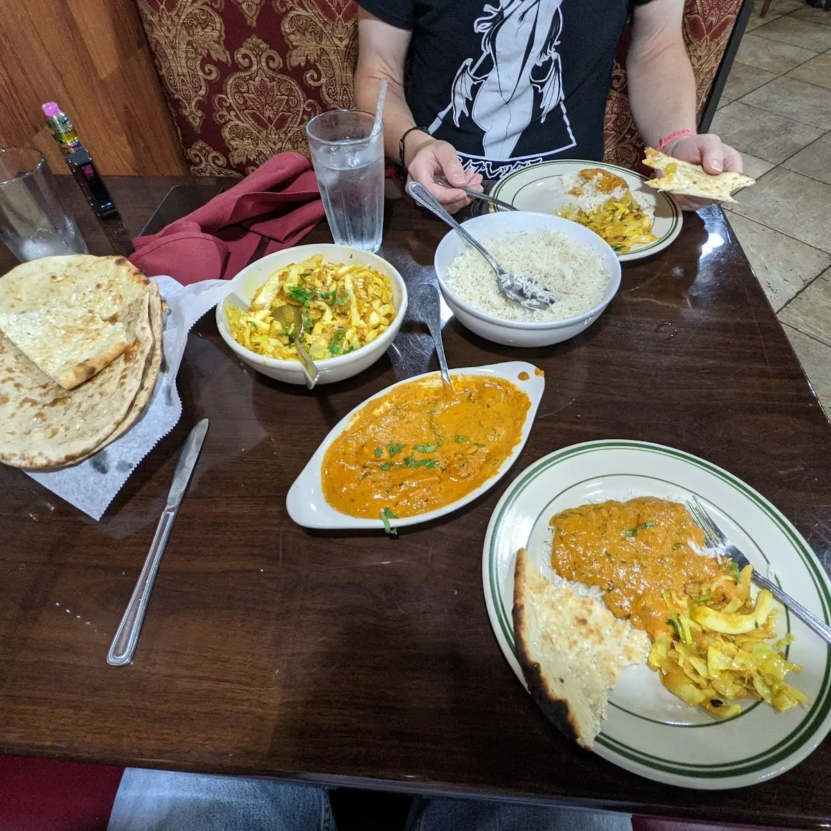 Chicken Curry and Coconut Cabbage Marsala the Bread Basket Has Paneer Naan and Roti