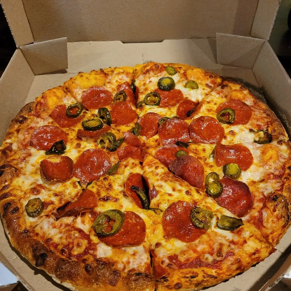 Hand Made Pan Pizza Peperoni and Jalapenos