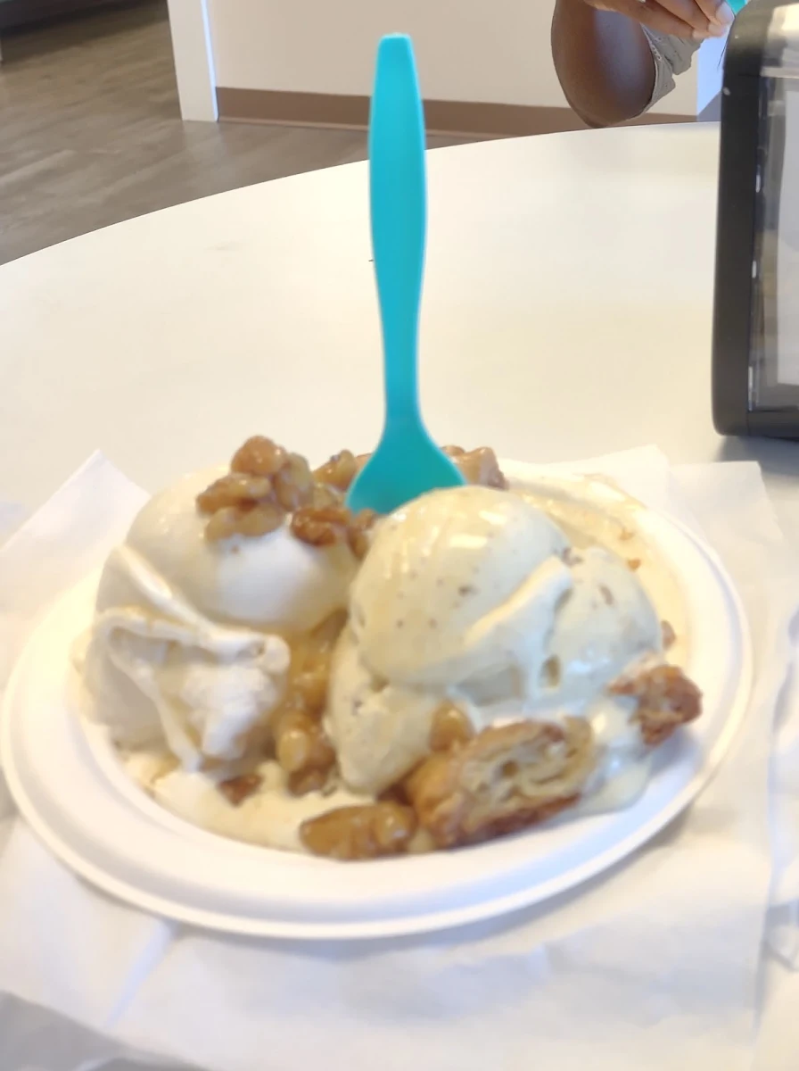 Ice Cream over Hot Apple Pie Dessert with Walnuts