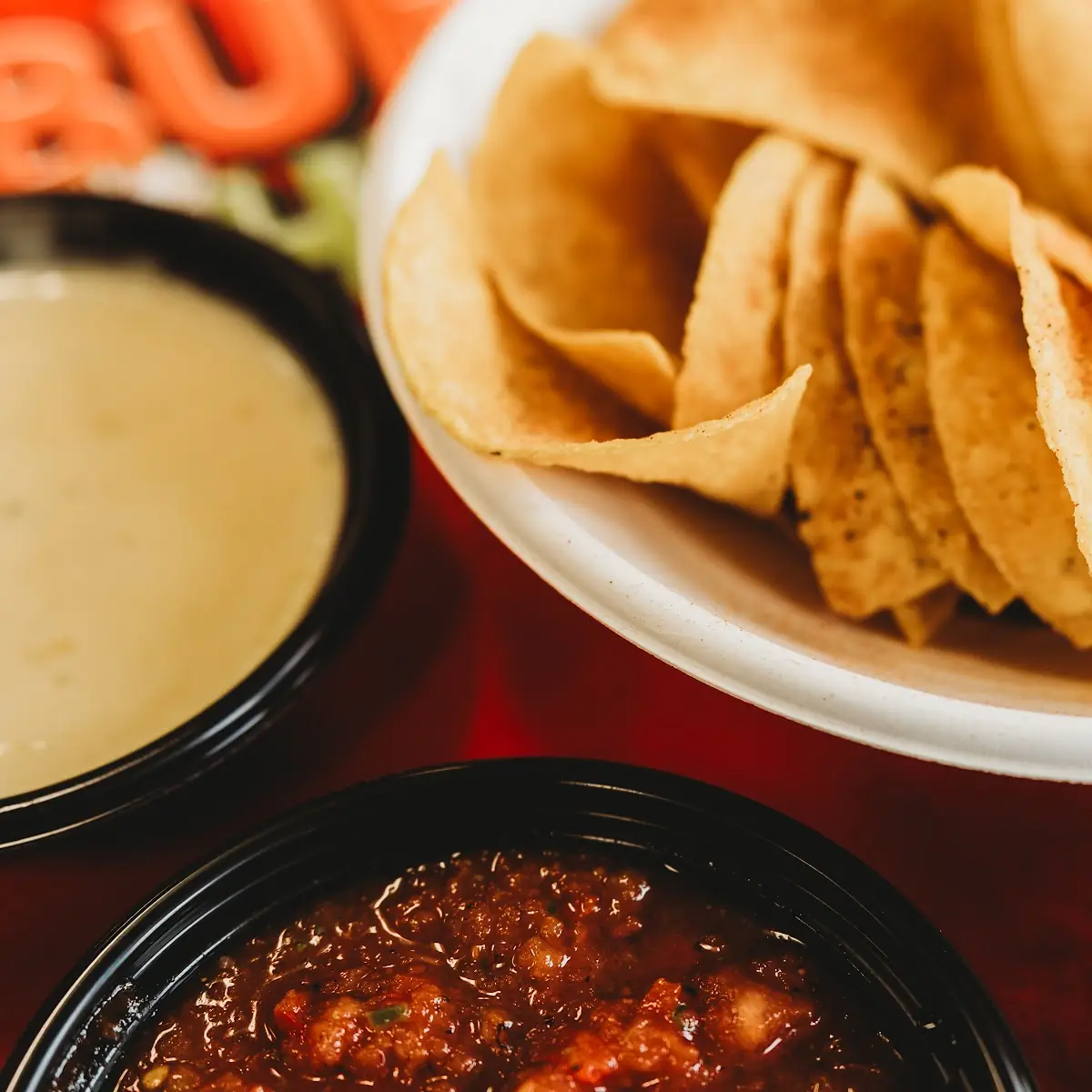 Dip Trio- Chips Salsa Guac Queso