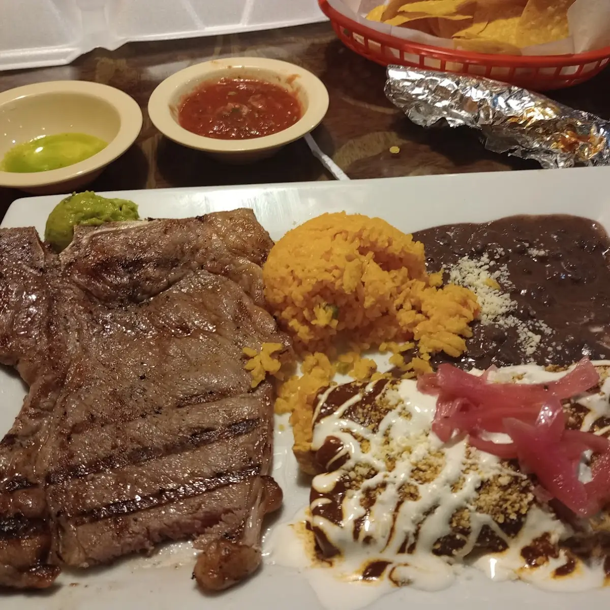 T-Bone Swith Rice Beans and Enchiladas