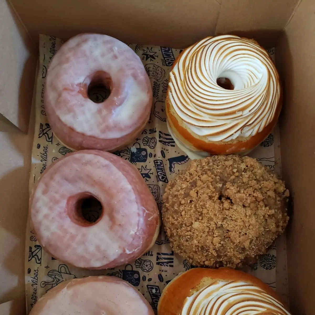 Assorted Donuts Strawberry Shortcake Chocolate Hazelnut Tres Leches Bacon Maple Syrupt