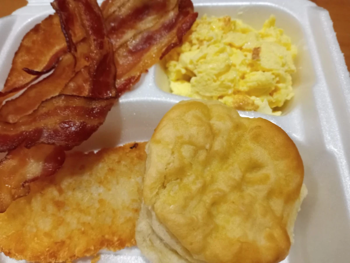 Bacon Eggs Hash Browns and Hot Biscuit