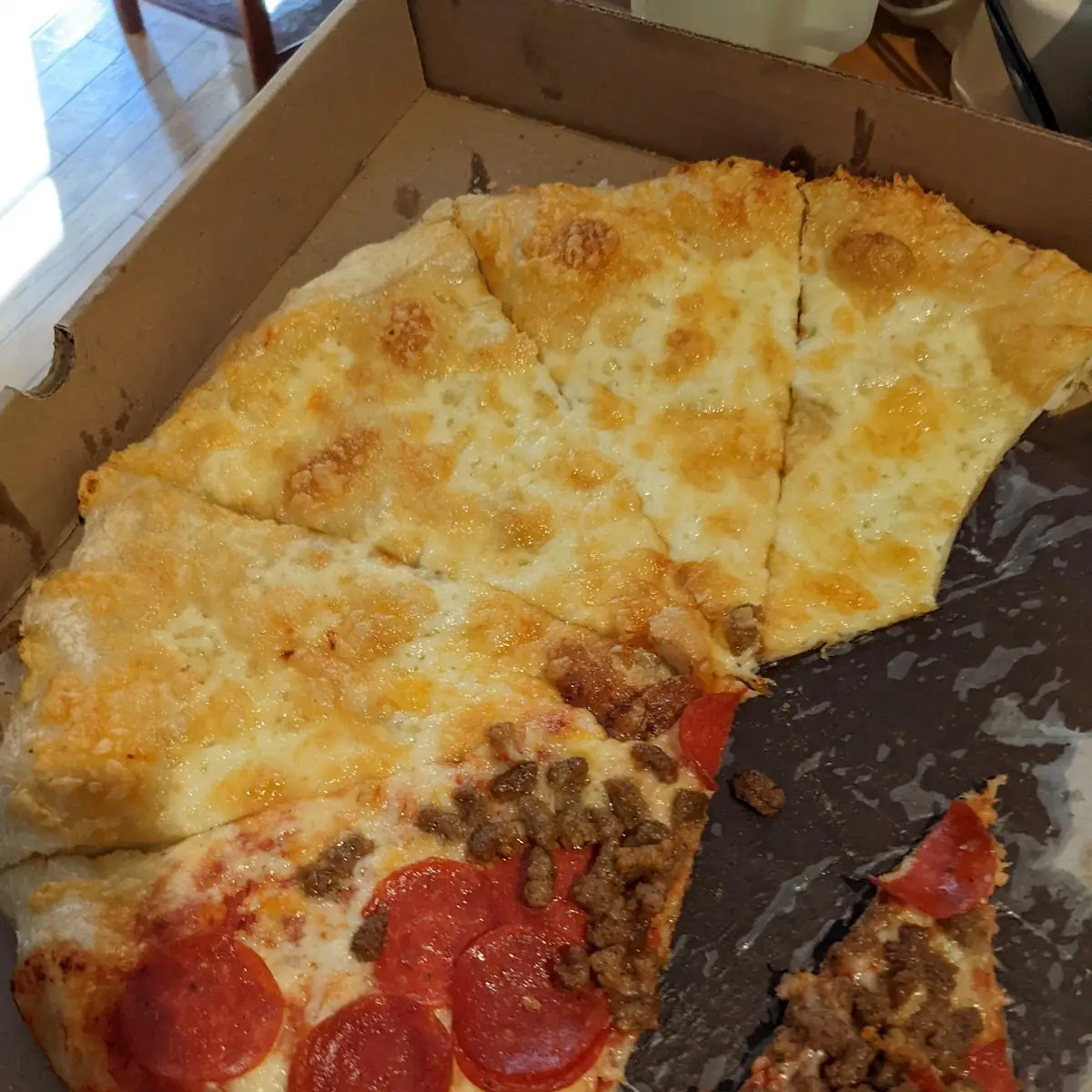 Half Cheese Without Sauce and Half Pepperoni and Sausage Pizza