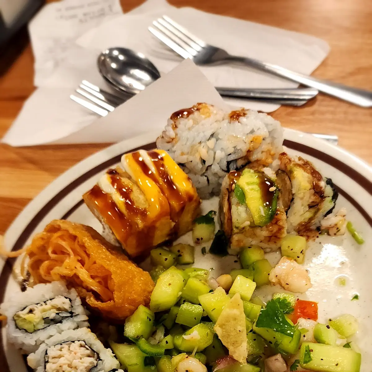 It's a Buffet so on the Plate There Are Several Things Various Types of Sushi and Shrimp Ceviche