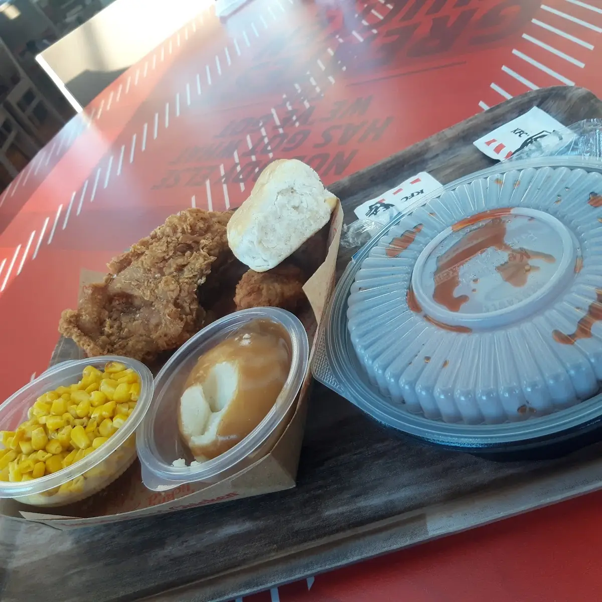 Mashed Potatoes with Gravy and Crispy Chicken Mild Buffalo Wings and a Biscuit