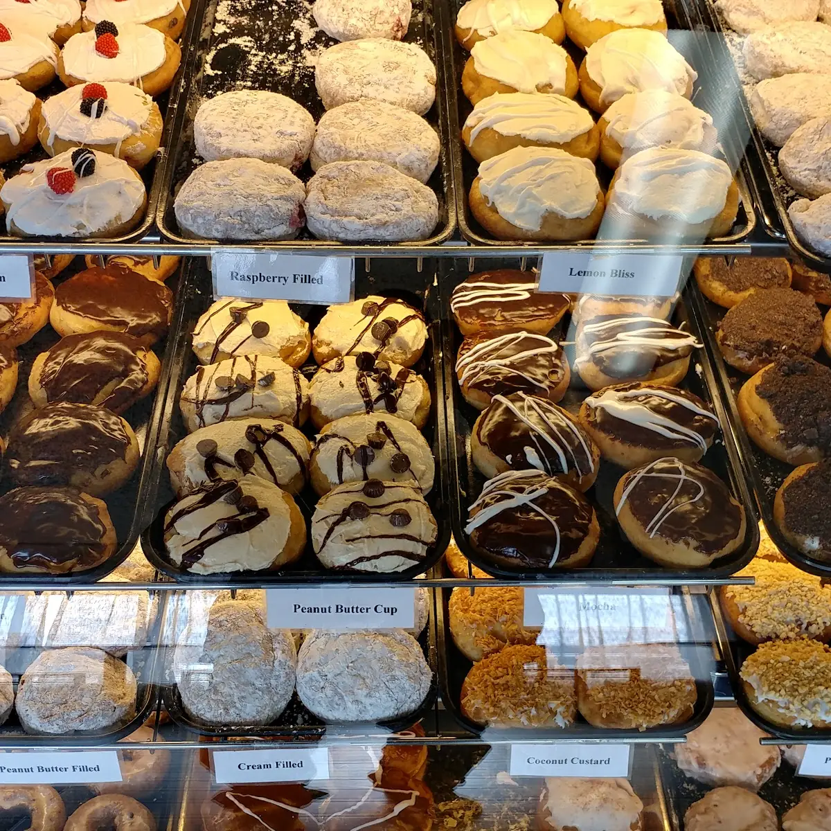 Handmade Deep Fried Pastries with Various Fillings and Icings