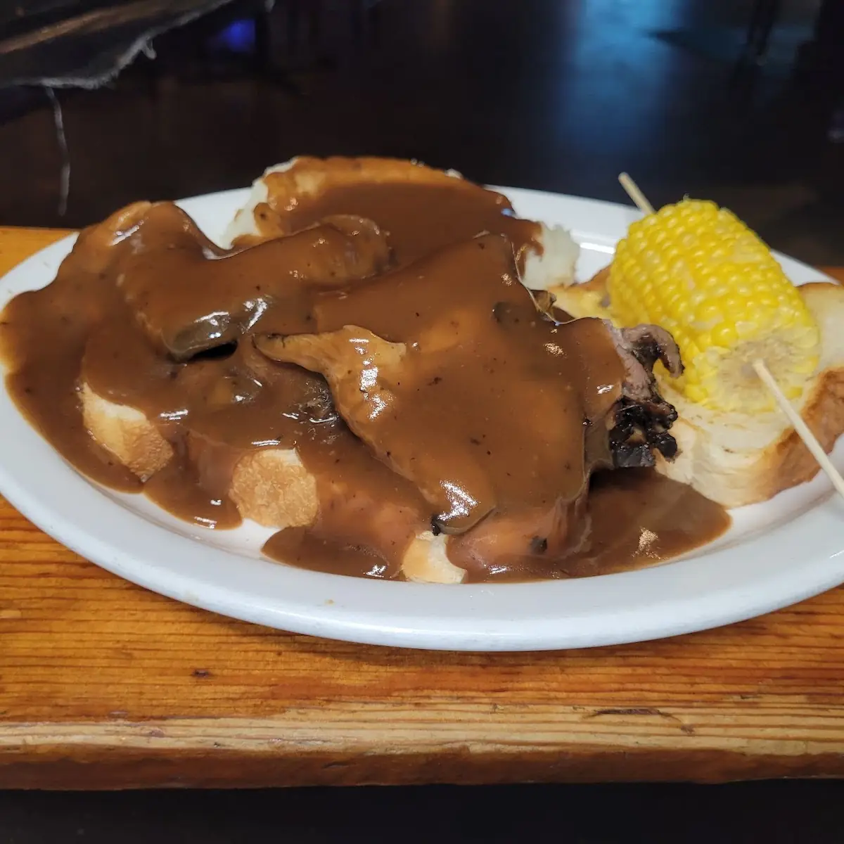 Open Faced Roast Beef Sandwich with Mashed Potatoes and Brown Gravyand a Vegetable