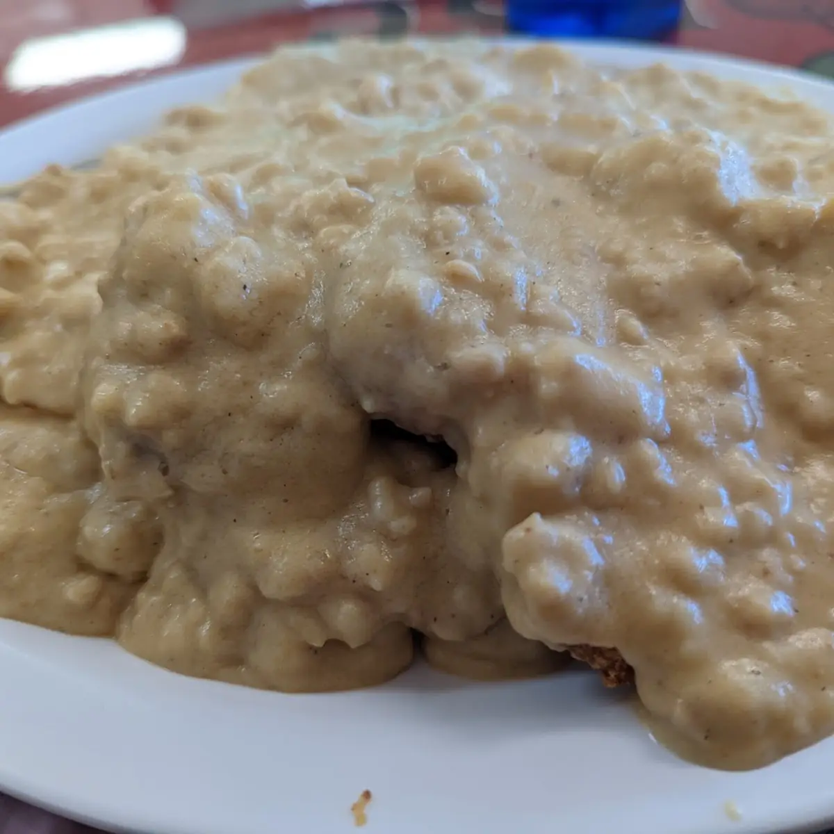 Sausage Gravy & Biscuits Served with 2 Eggs & Fresh Fruit