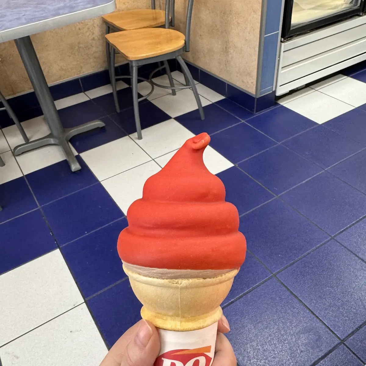 Chocolate Ice Cream Cone Dipped in Cherry