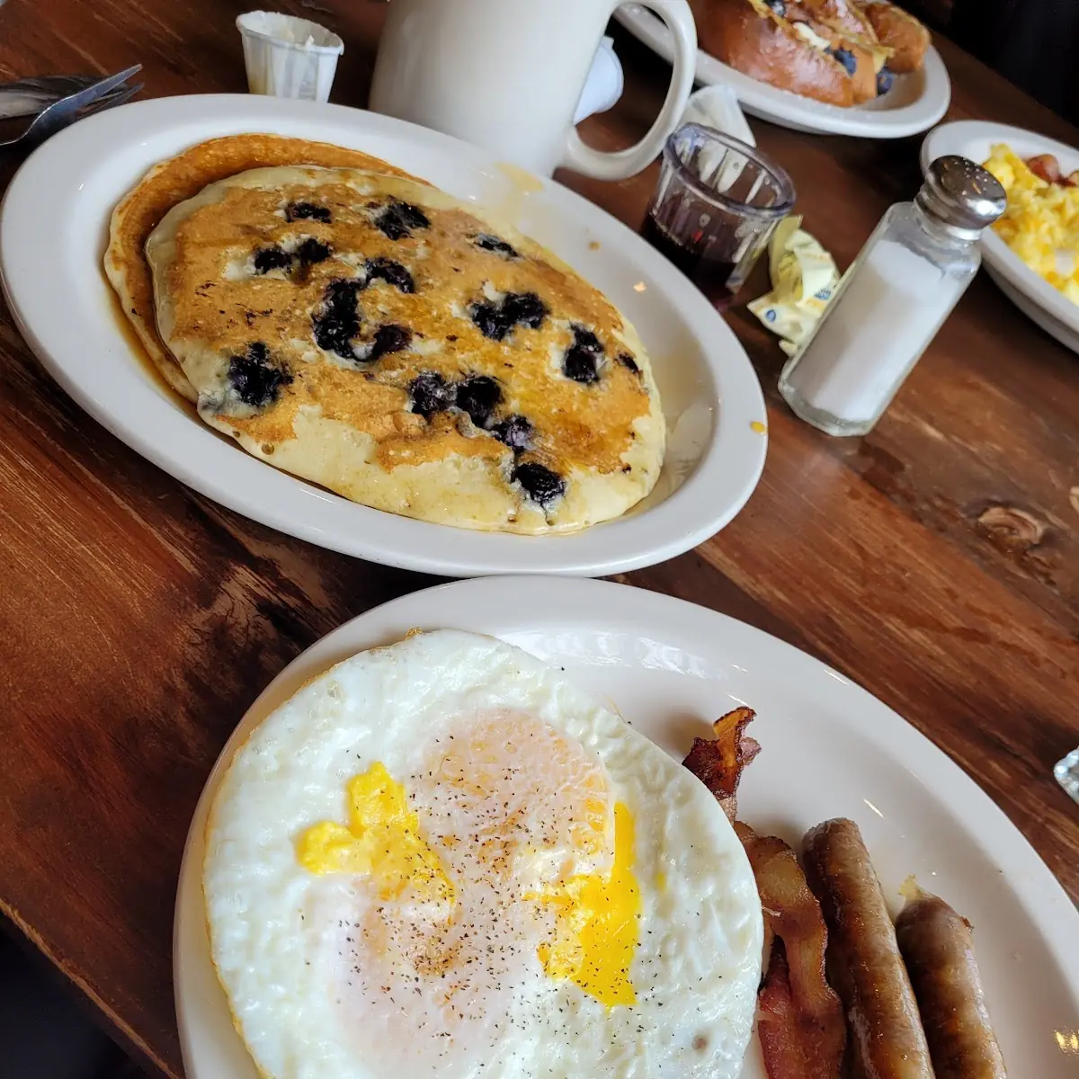 Eggs Blueberry Pancakes Sausage Links and Bacon